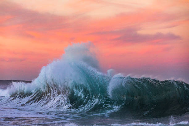 Powerful display of ocean waves colliding creating water explosion in dramatic light