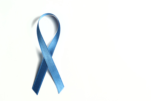 blue ribbon on a white background in protest against the abuse of minors, as well as a symbol of support and defense of education