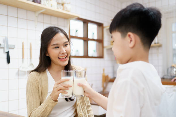istock Happy little boy drinking a milk. 1471530821