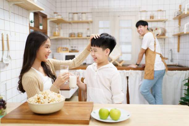 istock Happy little boy drinking a milk. 1471530883