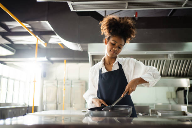istock Female chef cooking in kitchen. 1471531157