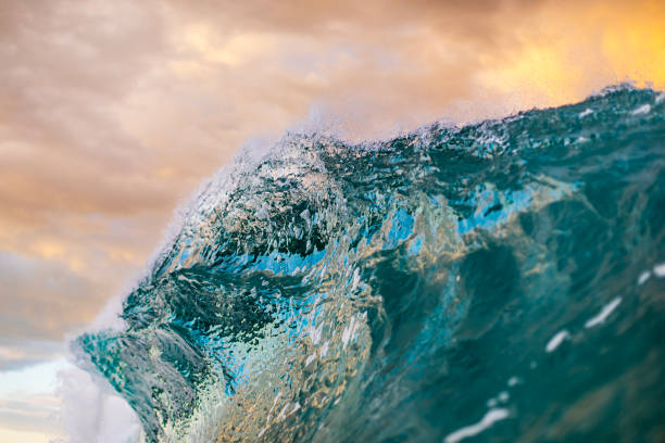 istock Ocean waves forming under a dramatic golden sky at sunset 1471531203