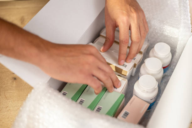 istock Person hands searching medicine in box 1471532159