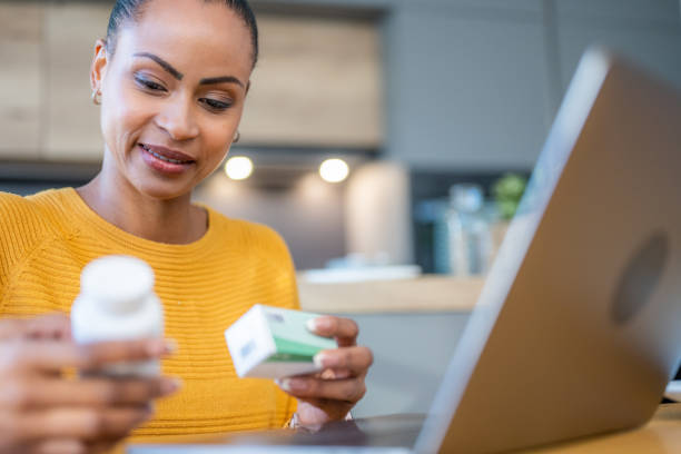 istock Woman searching medications instruction on laptop 1471532186