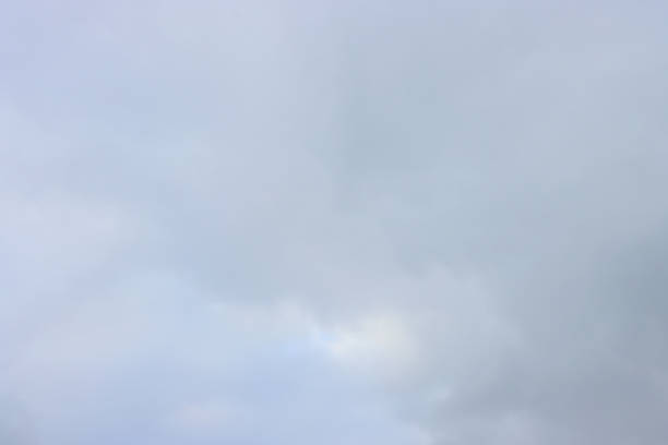 Sky with clouds, view with closed clouds above. White cumulus clouds.