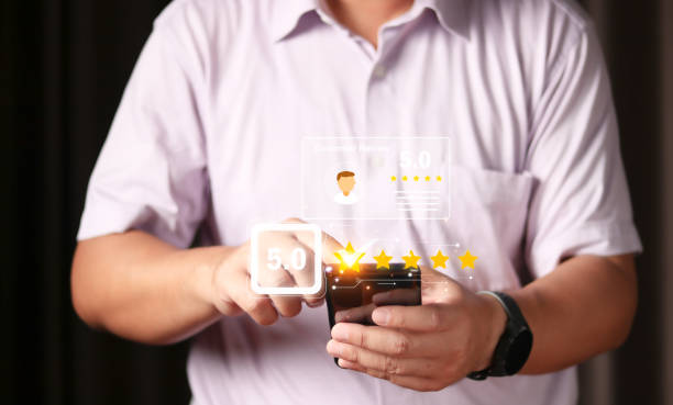 istock User gives rating to service experience on online application, Customer review satisfaction feedback survey concept, Customer can evaluate quality of service leading to reputation ranking of business. 1471547185