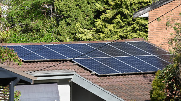 istock Solar electric panels on a roof 1471551272