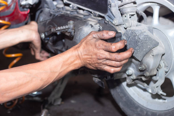 istock Motorcycle mechanic check the condition of Auto Transmission system 1471552314