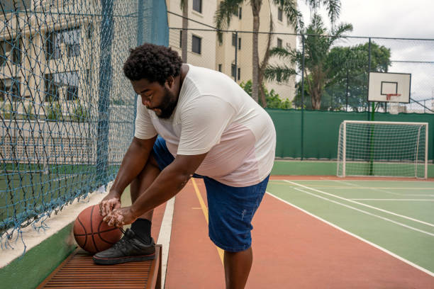 istock Black man with vitiligo preparing to play basketball 1471553583