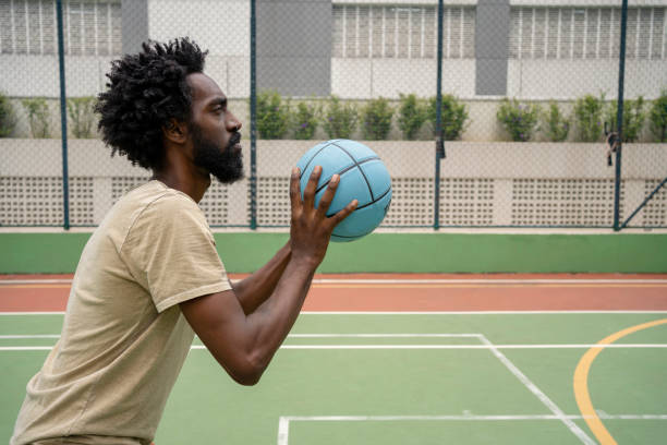 istock Black man training basketball free throw 1471554177