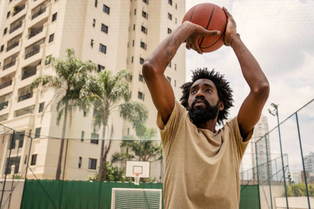 istock Black man training basketball free throw 1471554210