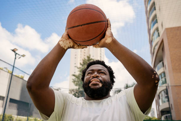 istock Black man training basketball free throw 1471554211