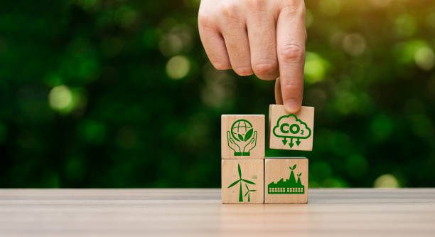 istock CO2 emission reduction concept, businessman with environmental technology Icons, global warming, sustainable development, renewable energy business. climate change, carbon capture, storage, reuse 1471557306
