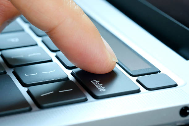 istock Finger of the computer user, he presses the delete button on the computer keyboard. 1471562302