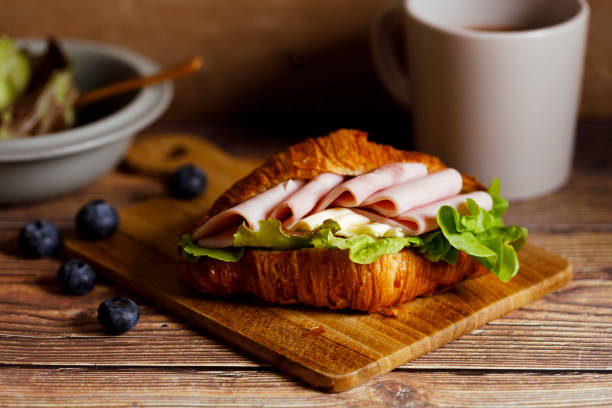 istock Croissant sandwich with ham and cheese. 1471562502