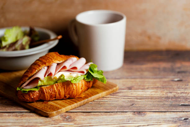 istock Croissant sandwich with ham and cheese. 1471562507
