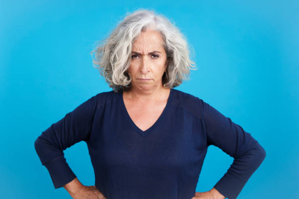istock Mature woman looking at camera with an upset expression 1471564895