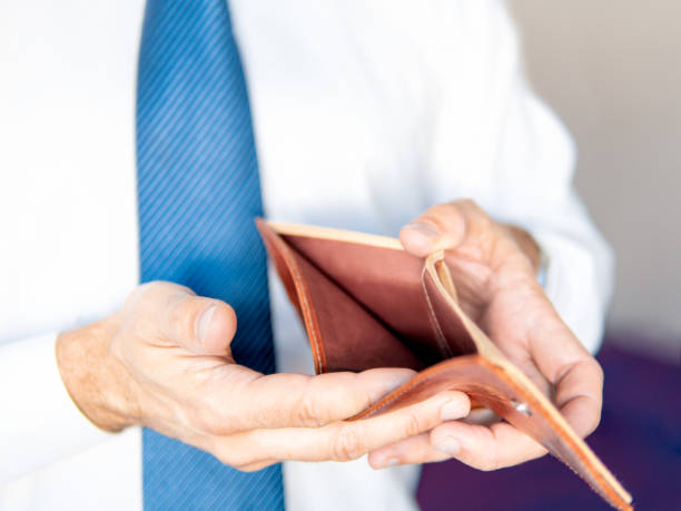 istock Man's hands holding empty wallet. Savings and investment concept. Selective focus. 1471570488