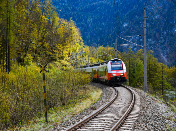 Hallstatt, Austria - Oct 25, 2018. Touristic train running in Hallstatt, Austria. Hallstatt is a charming lakeside village in the Alps.