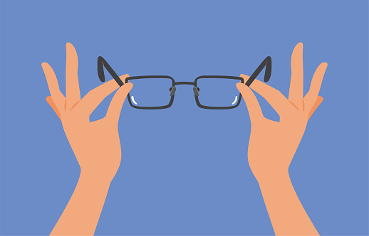 Person using glasses for myopia correction after prescription