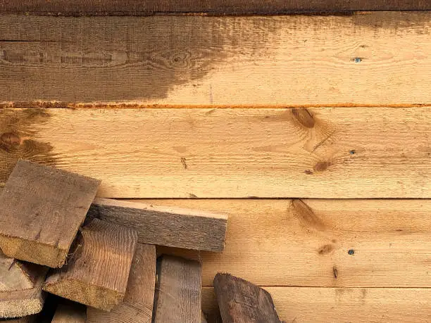 Photo of Background of wooden boards, wooden walls, saws.