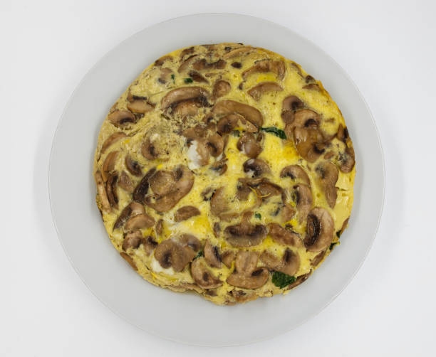 istock Omelette with mushrooms and cheese on white background. Top view. 1471575219
