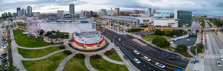 Panorama view of the Long Beach Pike and Convention center with a cloudy sky in the background.