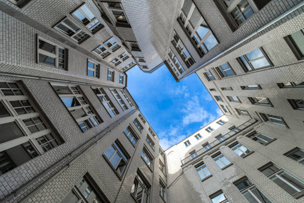 Low Angle View Of Residential Building Against Sky Low Angle View Of Residential Building Against Sky central berlin stock pictures, royalty-free photos & images