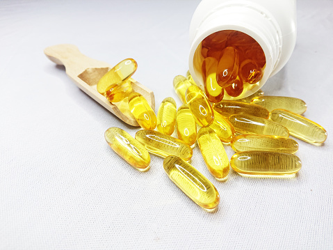Fish oil and bottle in white background stock photo