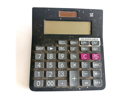 Blue calculator un white desktop - Business, finance or education concept.