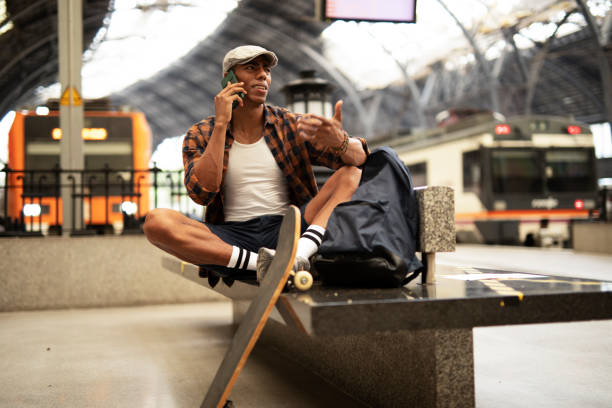 istock Happy young man waiting for the train. 1471581484