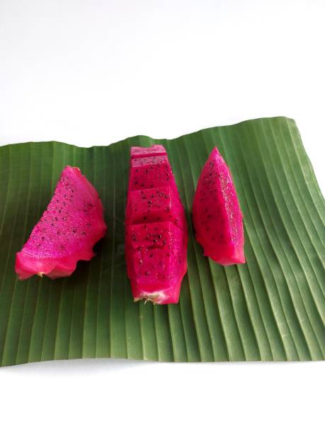 istock Dragon fruit pieces arranged on banana leaves 1471582919