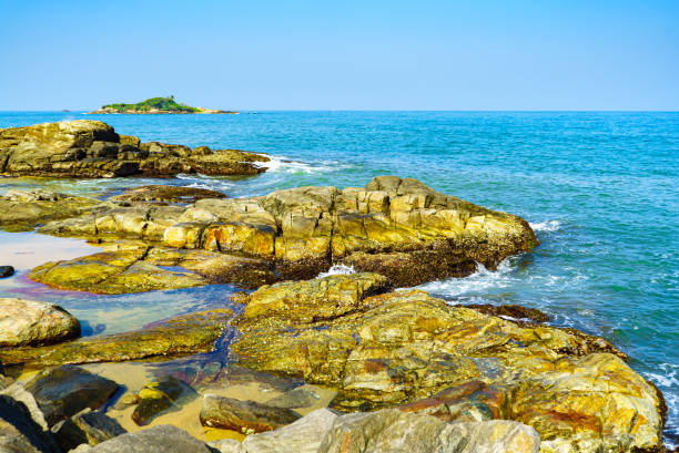 istock Ocean landscape on rocky shore at sunrise 1471583440