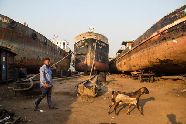 Photo documentary on working people in the shipyard. The shipyards along the riverbank of the Bangladesh capital. They break down massive shipping vessels as well as create new ships from the parts. I captured this image on March 9, 2022, from Dhaka, Bangladesh.