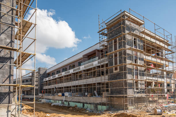 istock Construction scaffolding built on a new apartment building. new construction under construction 1471585858