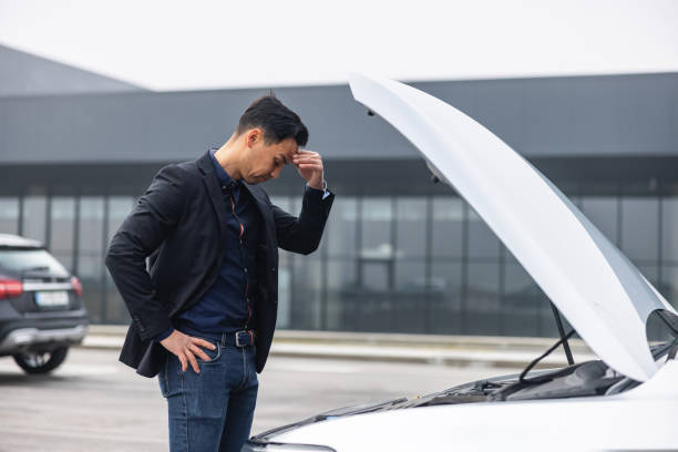 istock Man Checking Engine Oil In A Car 1471589105