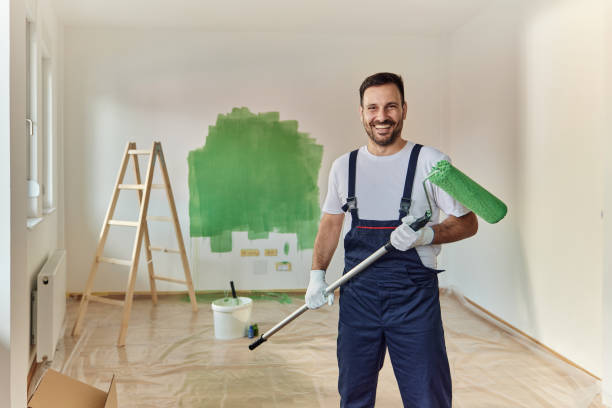 istock Happy house painter working on home renovation process. 1471589316