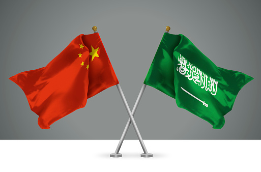 3D illustration of Two Wavy Crossed Flags of China and Kingdom of Saudi Arabia, Sign of Chinese and Saudi Relationships