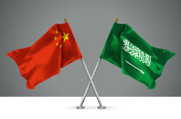 3D illustration of Two Crossed Flags of China and Kingdom of Saudi Arabia stock photo