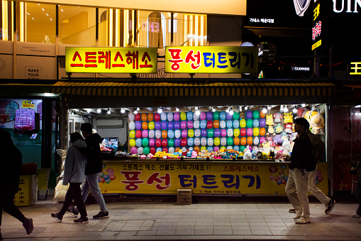 Balloon popping and darts game arcade shop in carnival games at Haeundae street night market for korean people and foreign traveler travel visit and playing on February 17, 2023 in Busan, south Korea