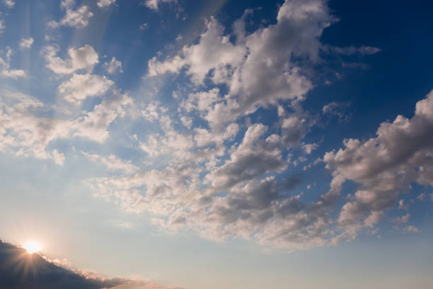 istock Sky with altocumulus clouds and sun beams from behind cloud 1471590495