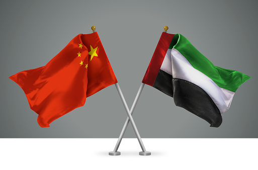 3D illustration of Two Wavy Crossed Flags of China and United Arab Emirates, Sign of Chinese and Emirati Relationships