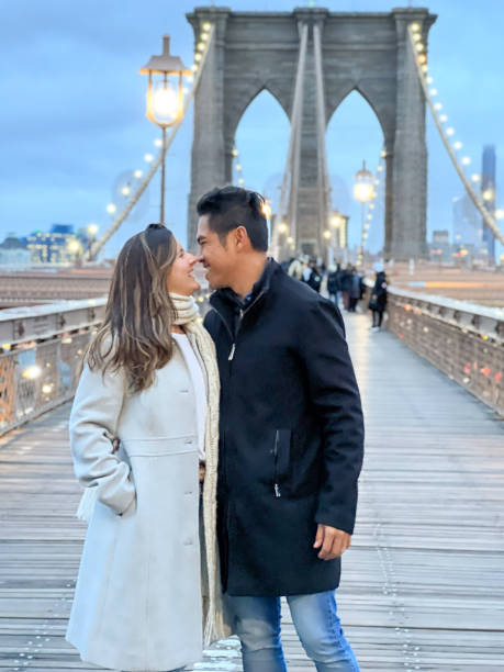 istock Couple in NYC walking on the Brooklyn bridge 1471592405