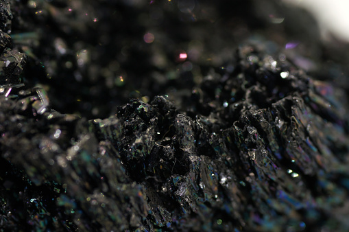 Picture background made of black glittering rock