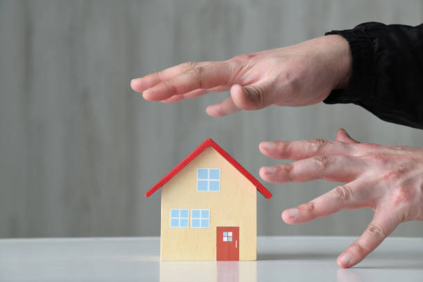 istock Criminal's hand reaching to house object 1471593135