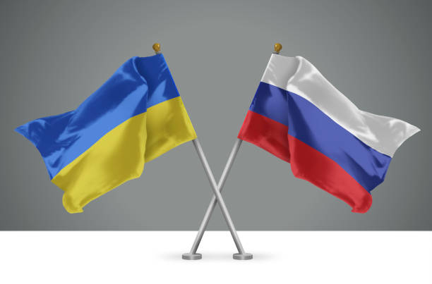 3D Illustration of Two Crossed Flags of Ukrain and Russia stock photo