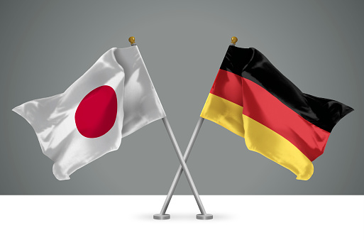 3D illustration of Two Wavy Crossed Flags of Japan and Germany, Sign of Japanese and German Relationships