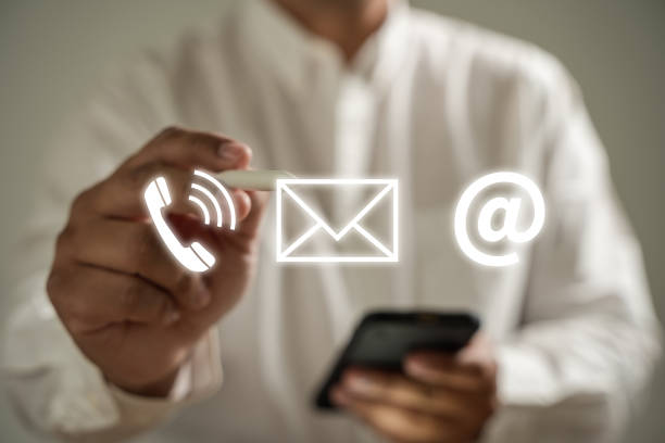 istock CONTACT US (Customer Support Hotline people CONNECT ) Businessman touching phone application check  email 1471594841