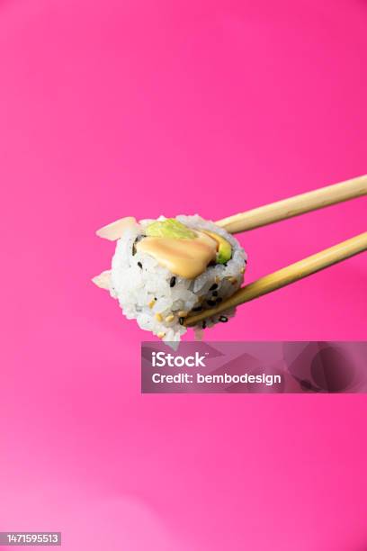 Uramaki Sushi With Chopsticks On A Pink Background Stock Photo - Download Image Now - Box - Container, Take Out Food, Chopsticks