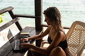 Digital nomad Woman Working With a Beach View